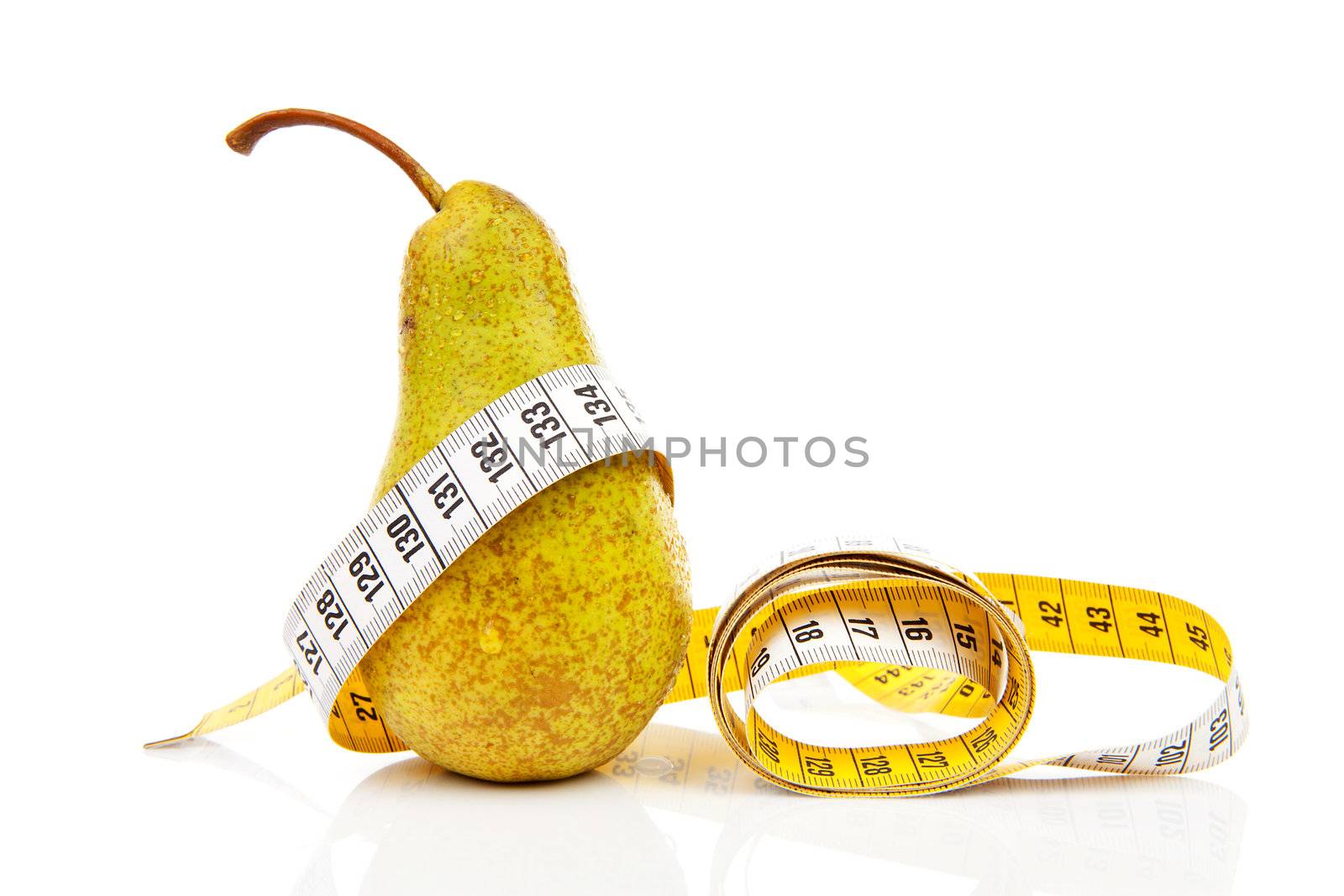 healthy diet; fresh pear with measure tape over white background