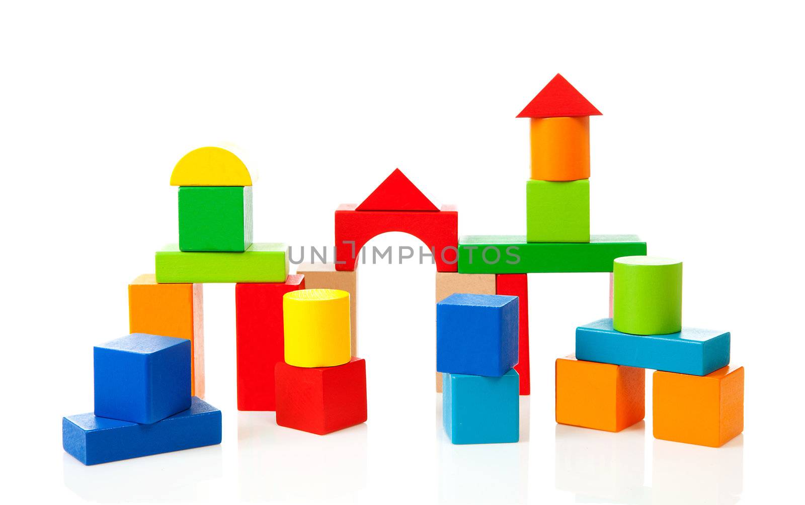 House made out of colorful wooden building blocks over white background