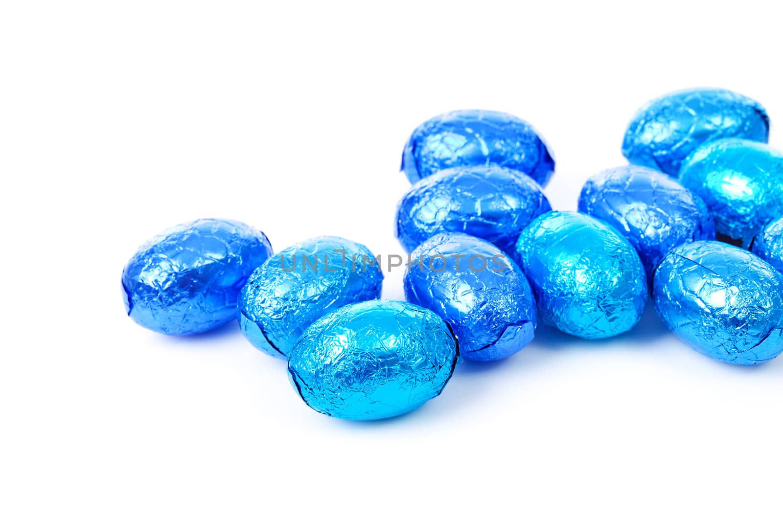 blue wrapped easter eggs over white background