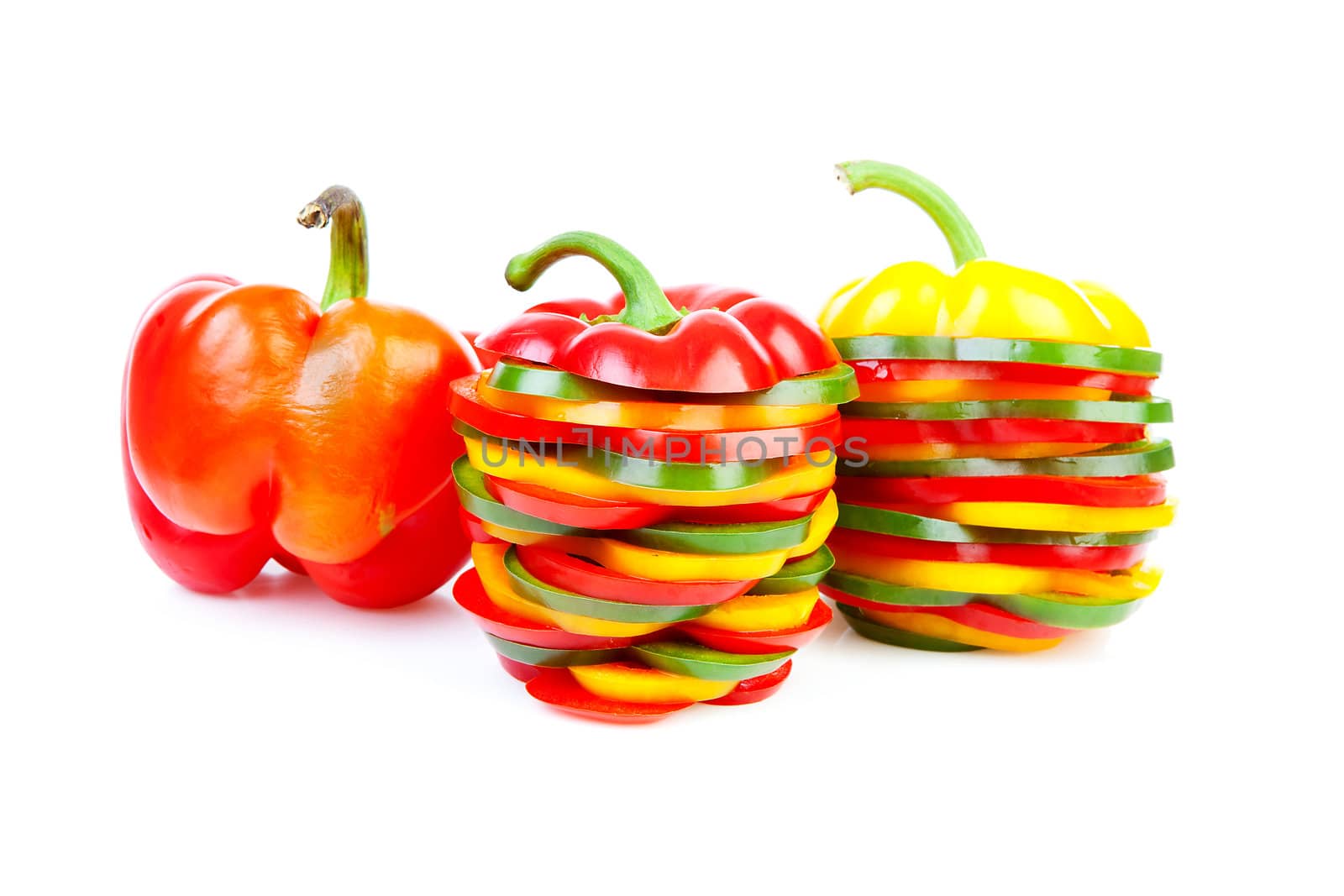 Paprika made out of colorful slices over white background