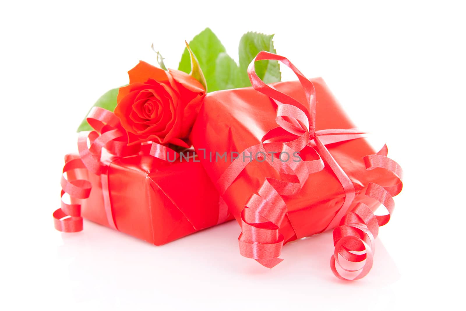 red presents and rose for Valentines over white background