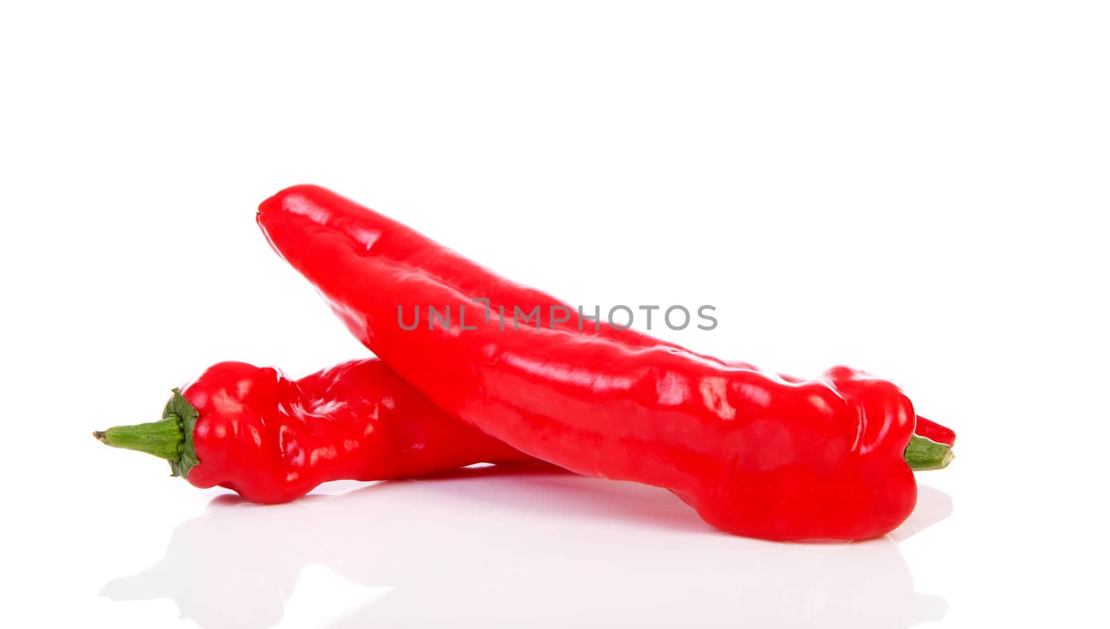 Two red paprika over stacked white background