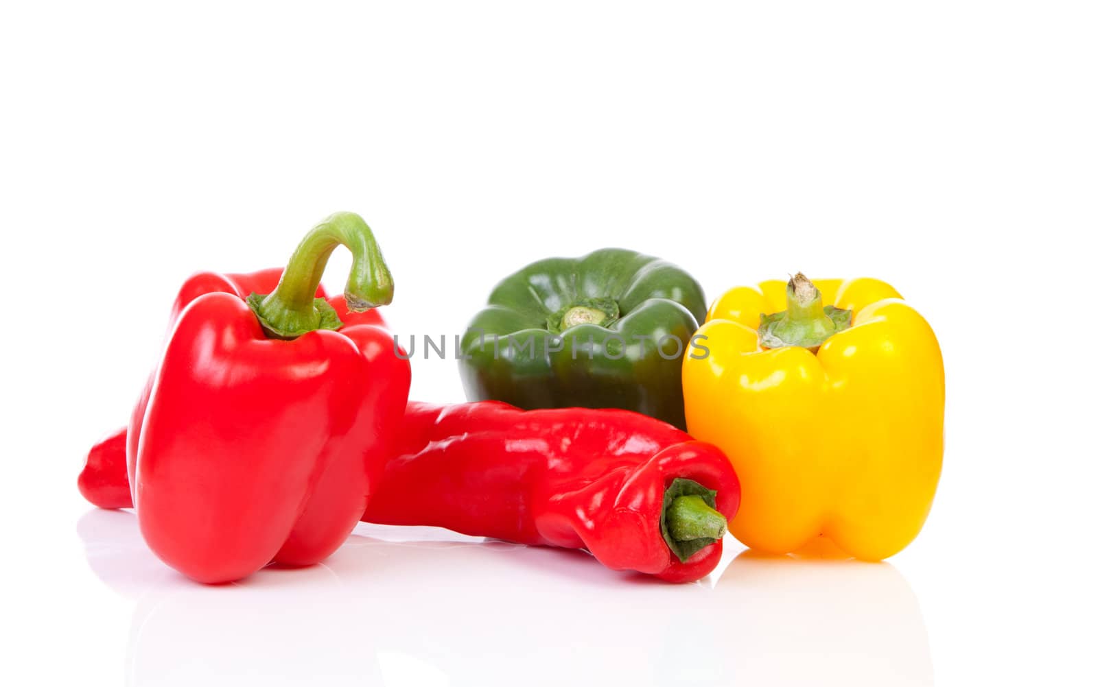 Various colorful paprika over white background