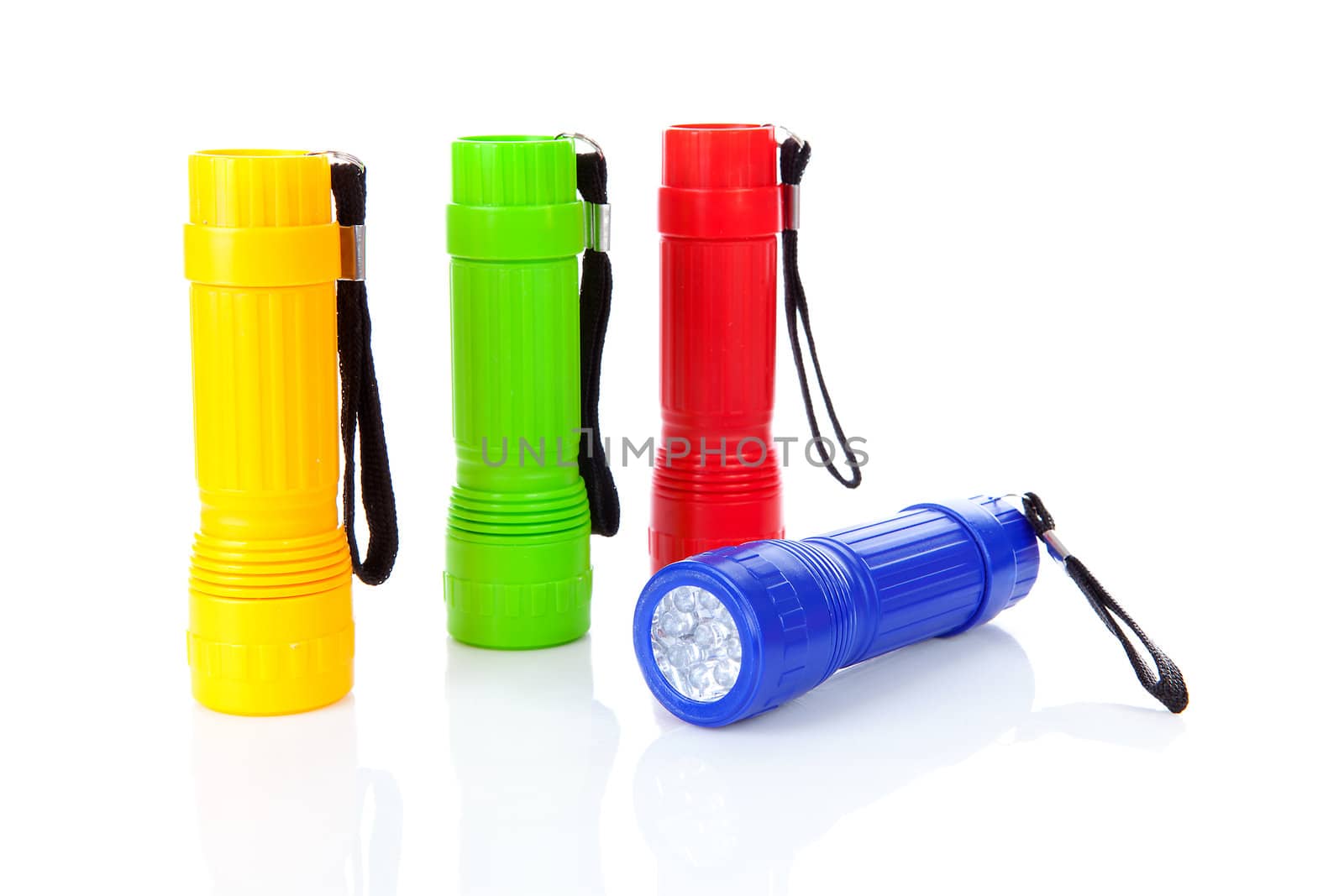 Four colorful flashlights in a row over white background