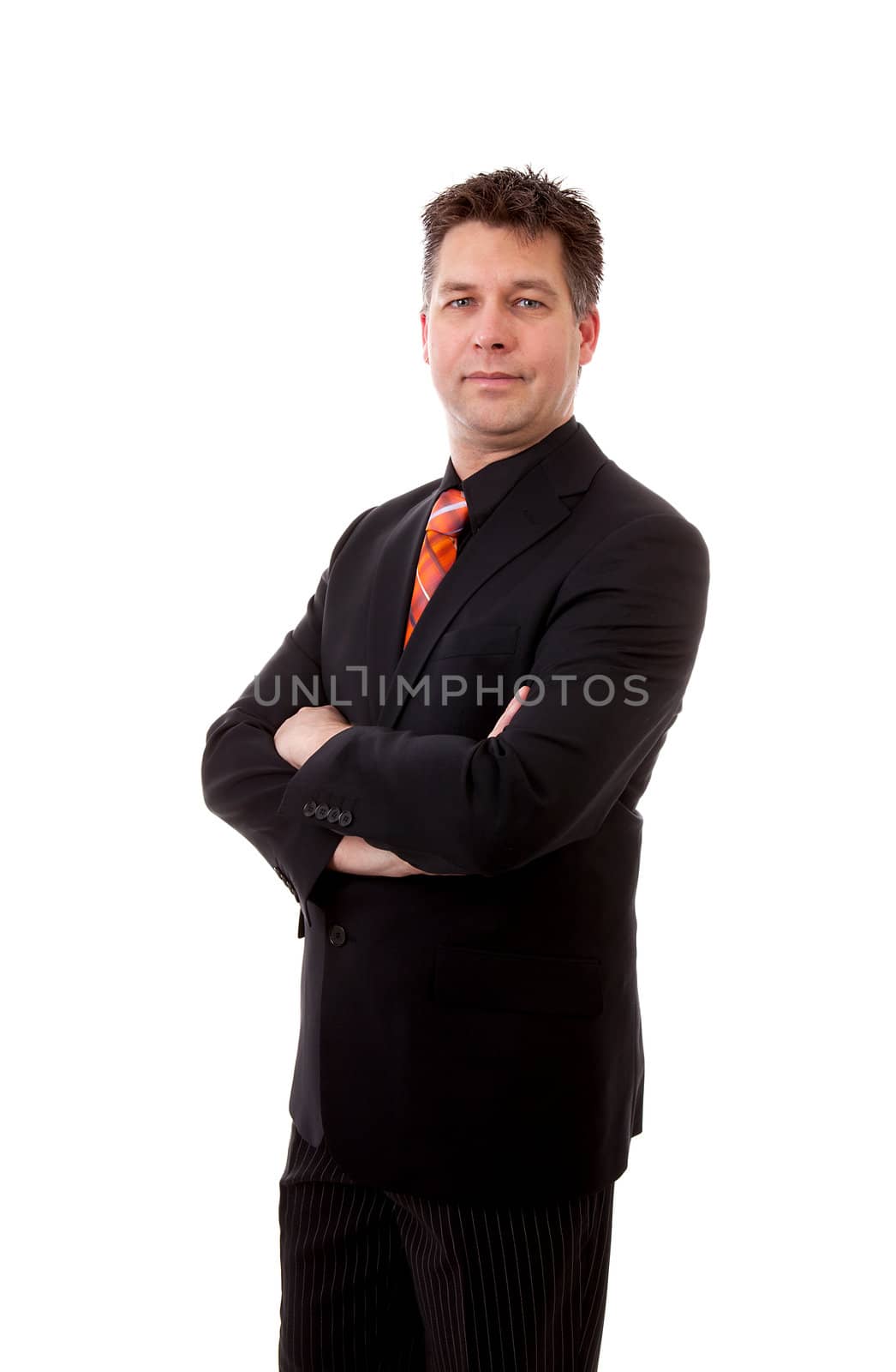 businessman is looking at camera with arms crossed over white background