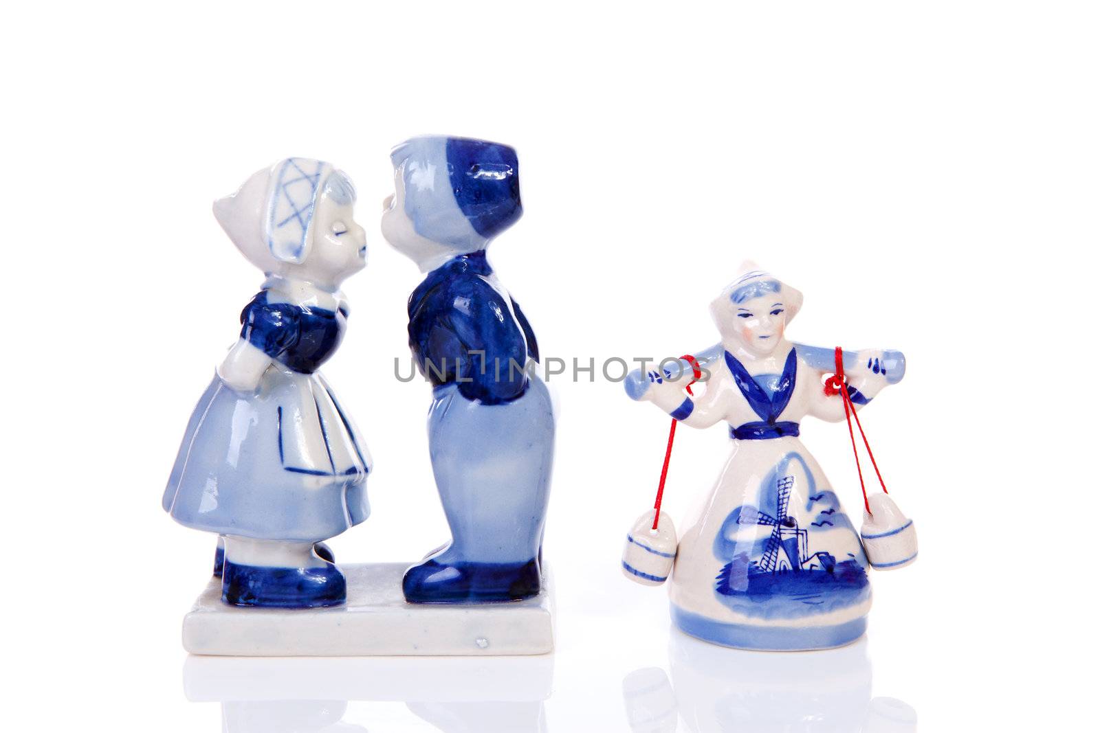 Two Dutch souvenir statues over white background