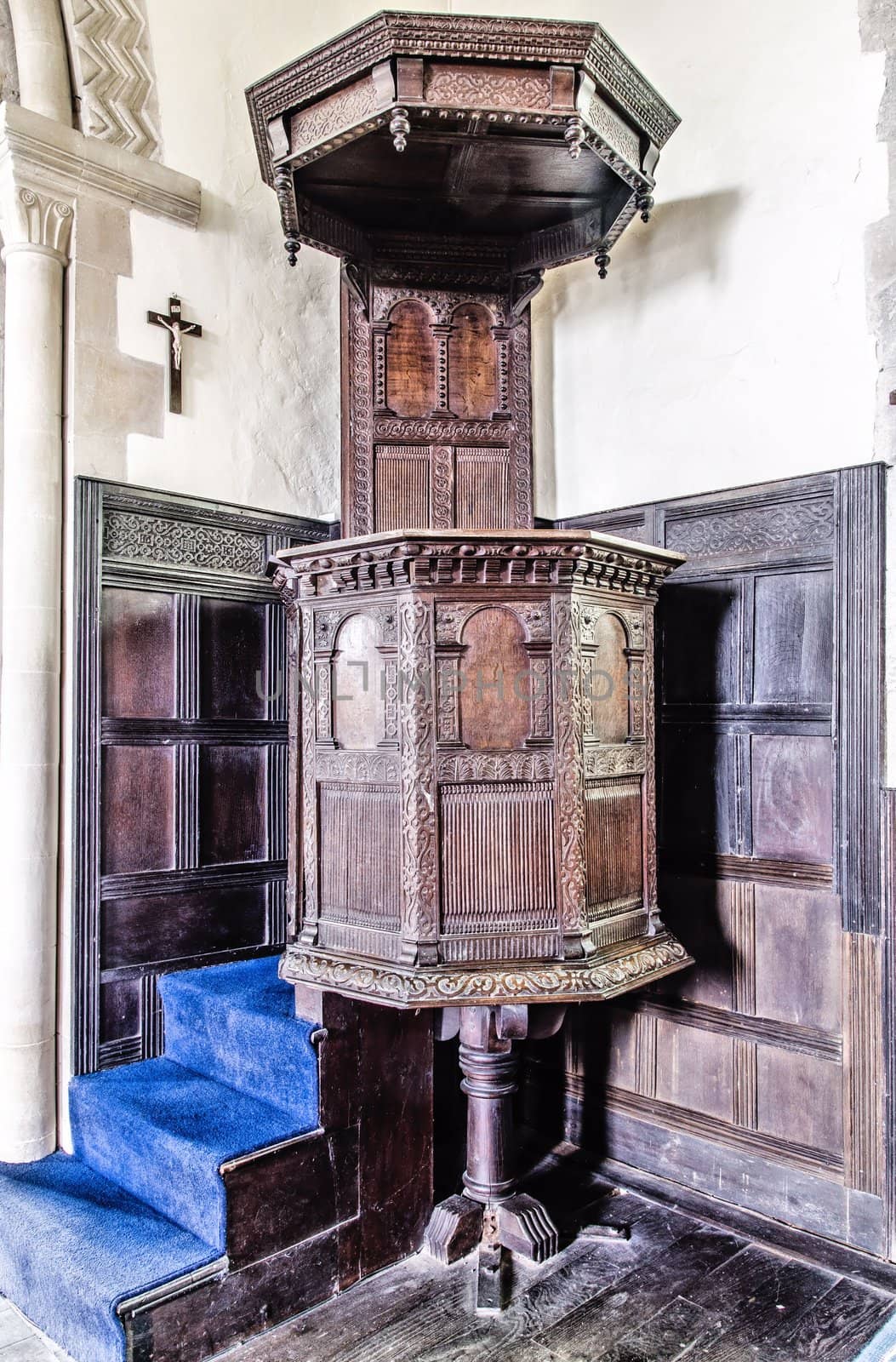 Old ornate carved wooden pulpit