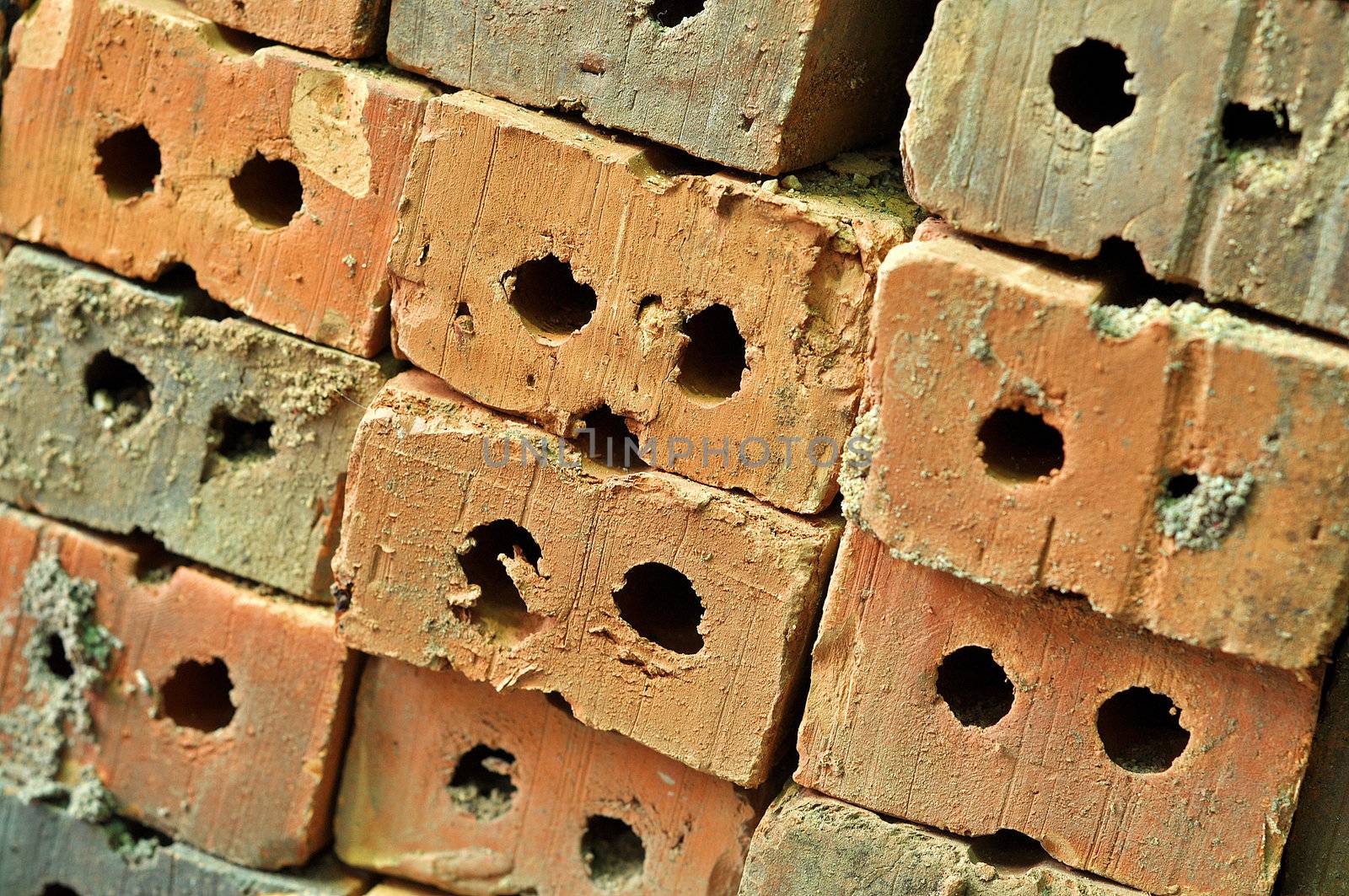 A brick is a block of ceramic material used in masonry construction, usually laid using various kinds of mortar.