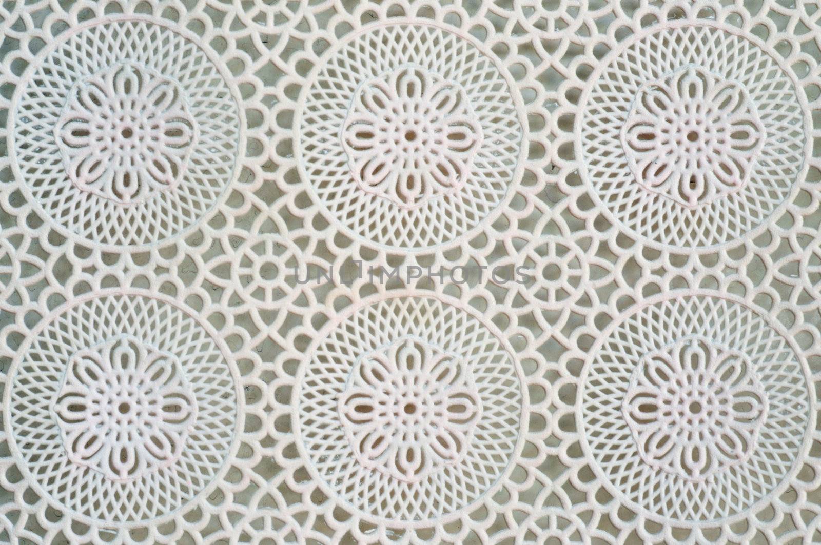 Lace is an openwork fabric, patterned with open holes in the work, made by machine or by hand.