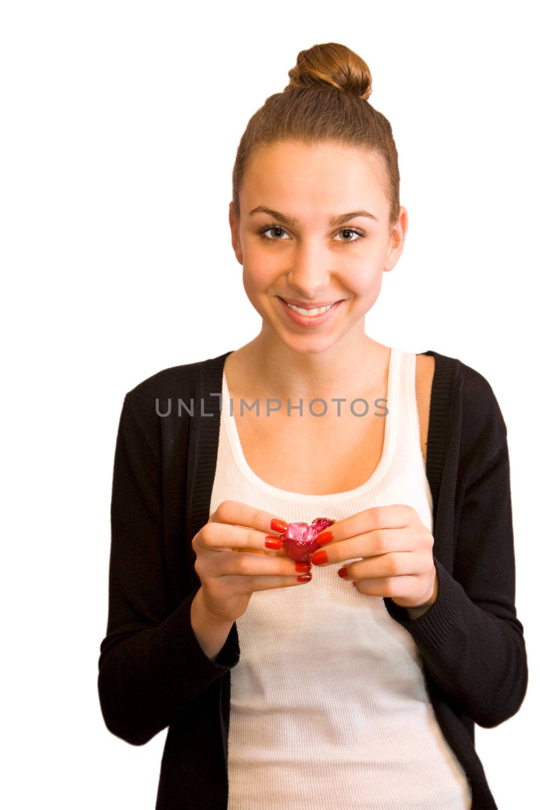 Young girl with chocolate candy isolated on white