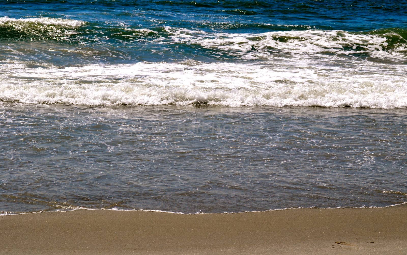 Sand and Waves by RefocusPhoto