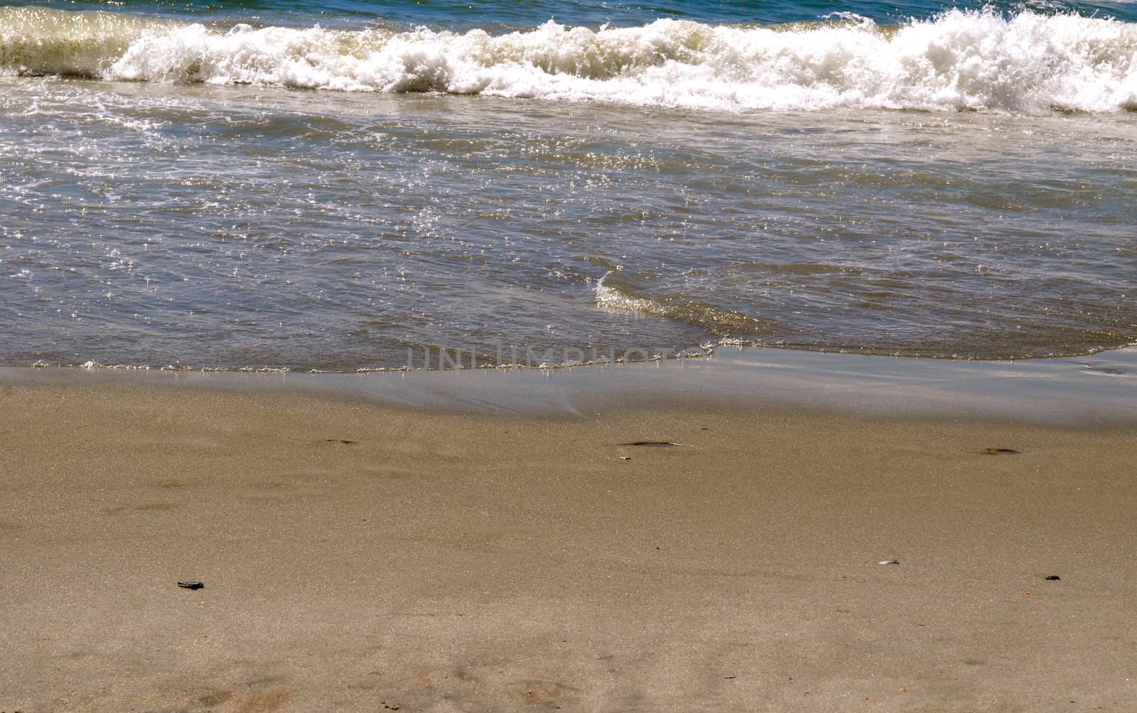 Sand and Waves by RefocusPhoto