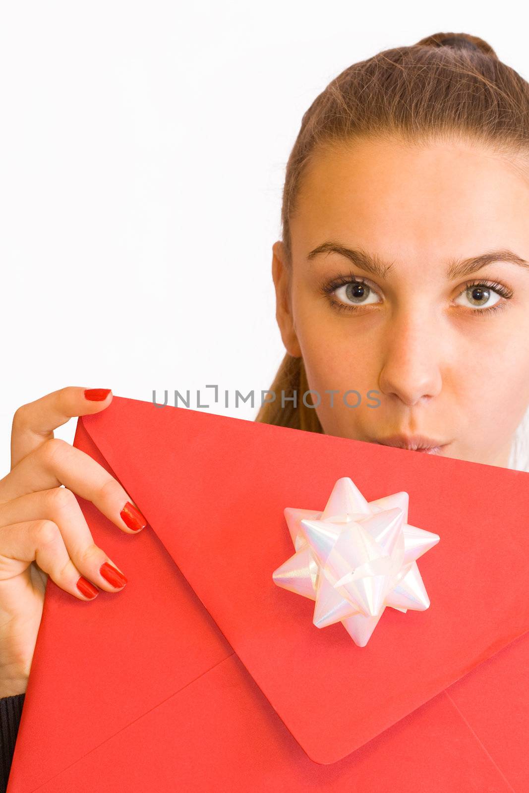 Young girl with red valentine's envelope, studio shot