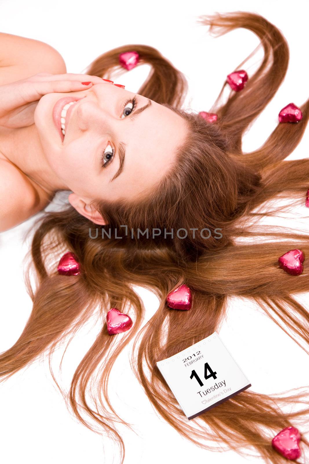 Young pretty girl with a calendar card, valentine's day