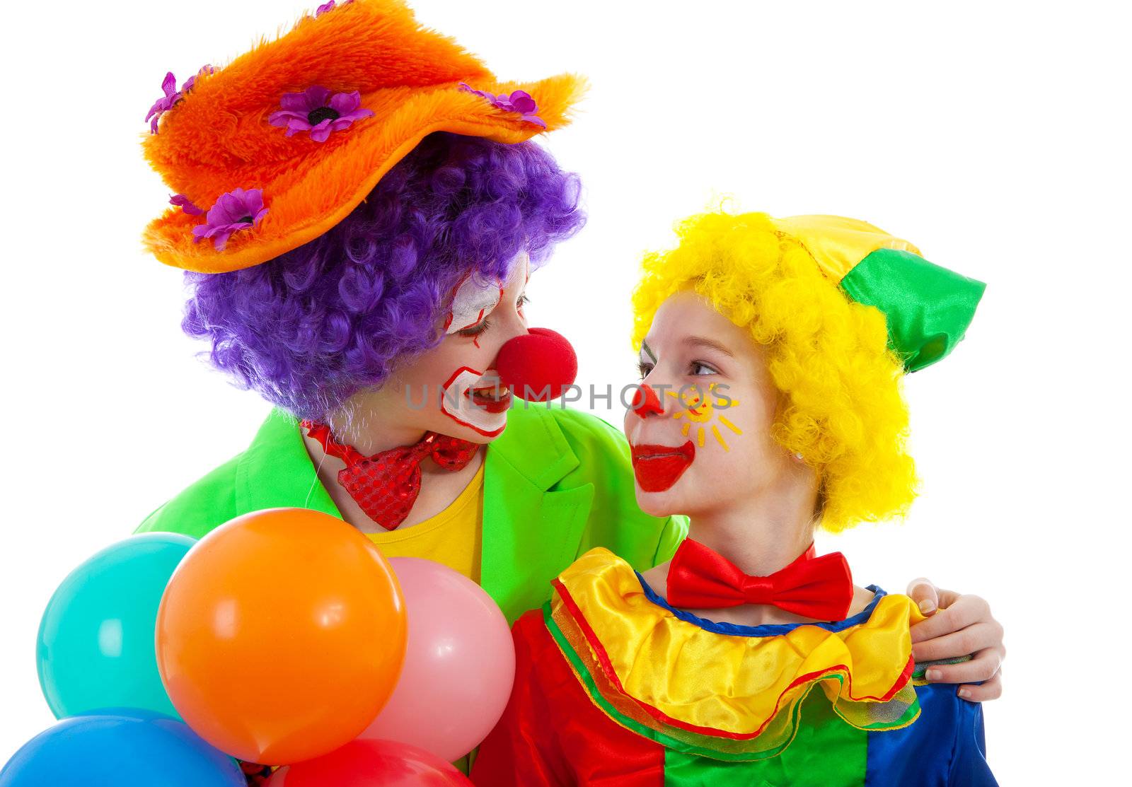 two children dressed as colorful funny clown with balloons over white background
