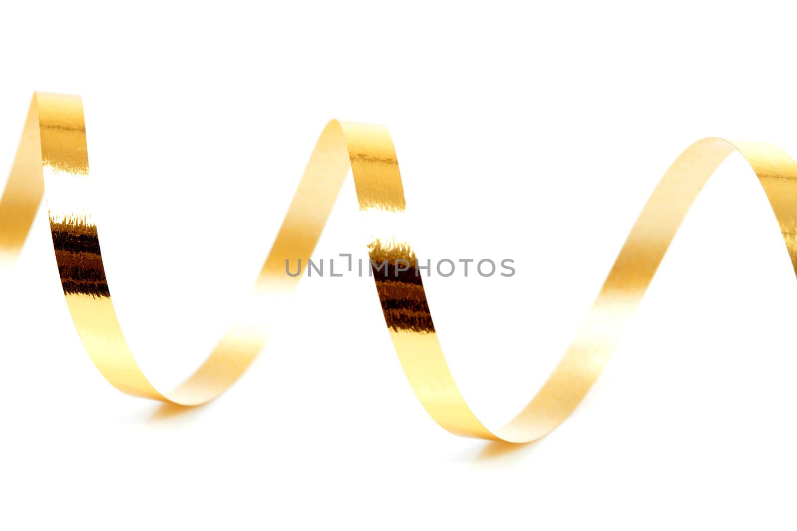 Golden curly streamer over white background