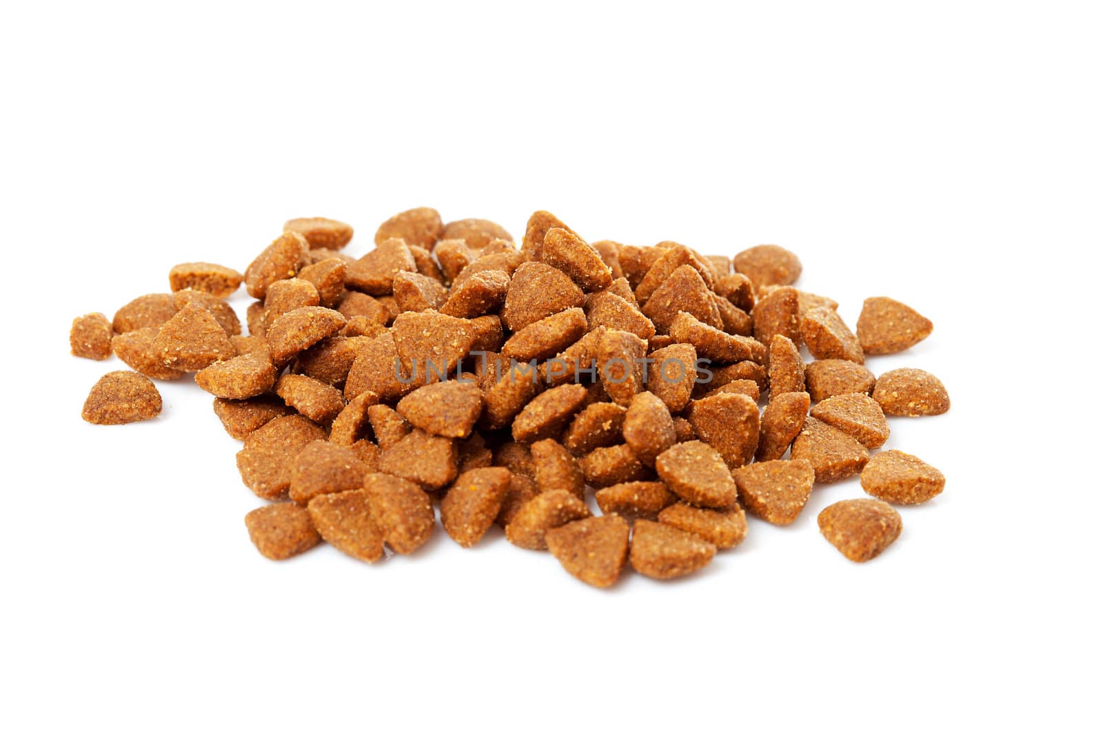 pile of dry cat food over white background