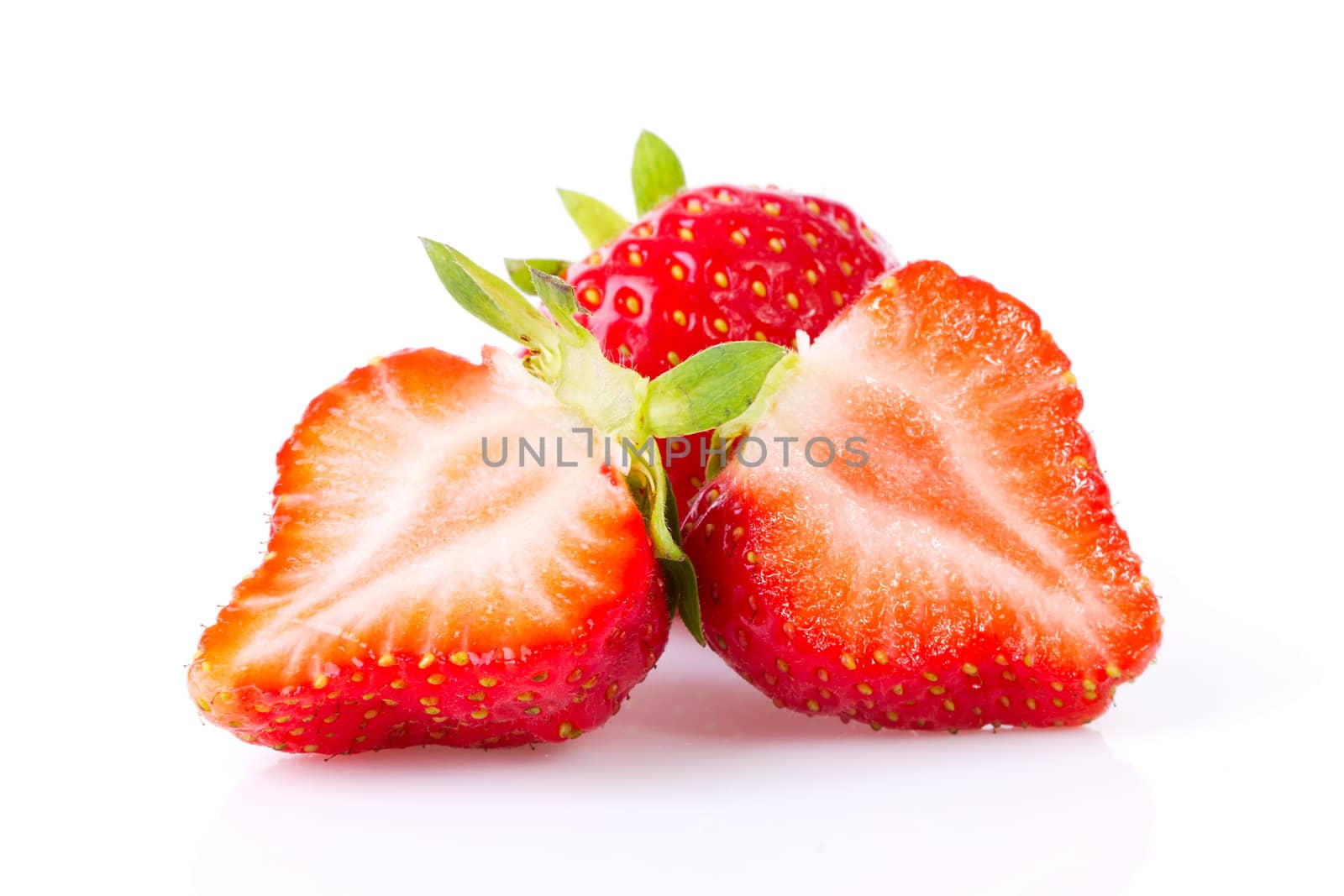 Two half strawberries in closeup over white background