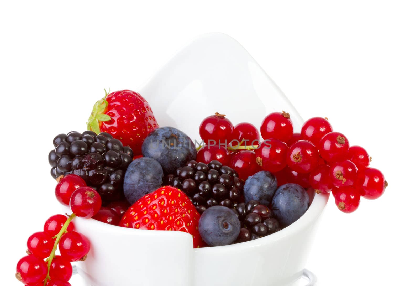 French fries bag filled with fresh fruit like healthy snack over white background