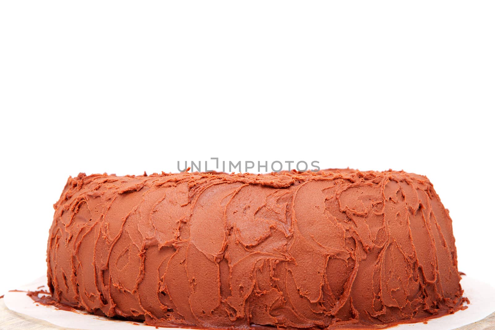 delicious chocolate cake in closeup over white background