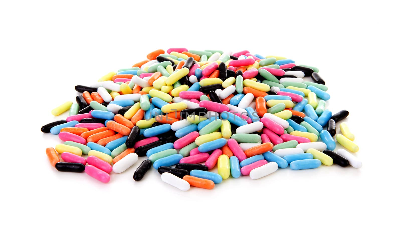 Pile of colorful laces rods candy over white background
