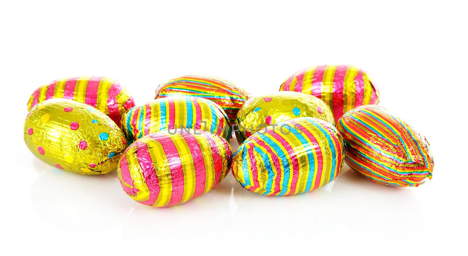 colorful chocolate easter eggs over white background 