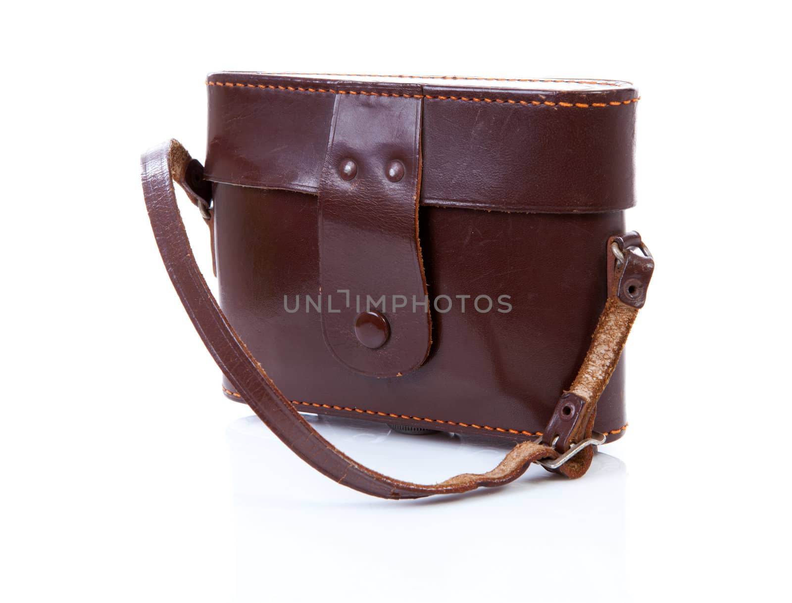 Old brown leather photocamera bag over white background