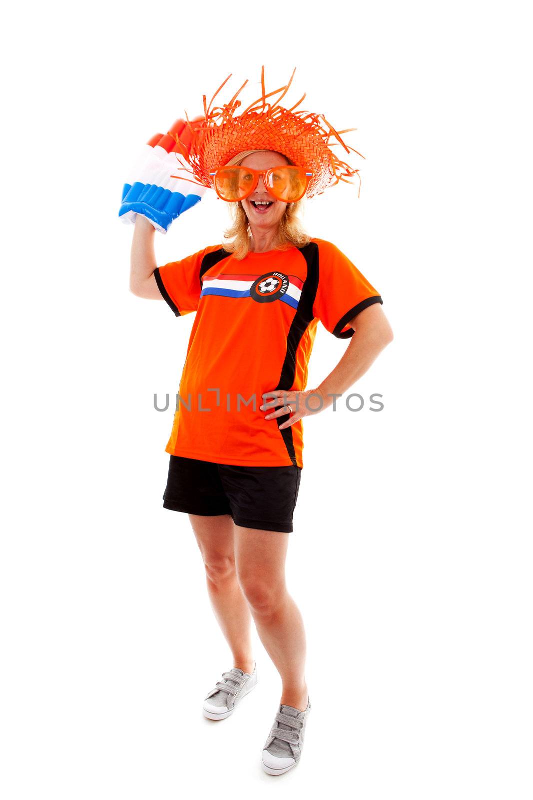 Dutch female soccer supporter in orange outfit with big blown up hand ready for the match over white background