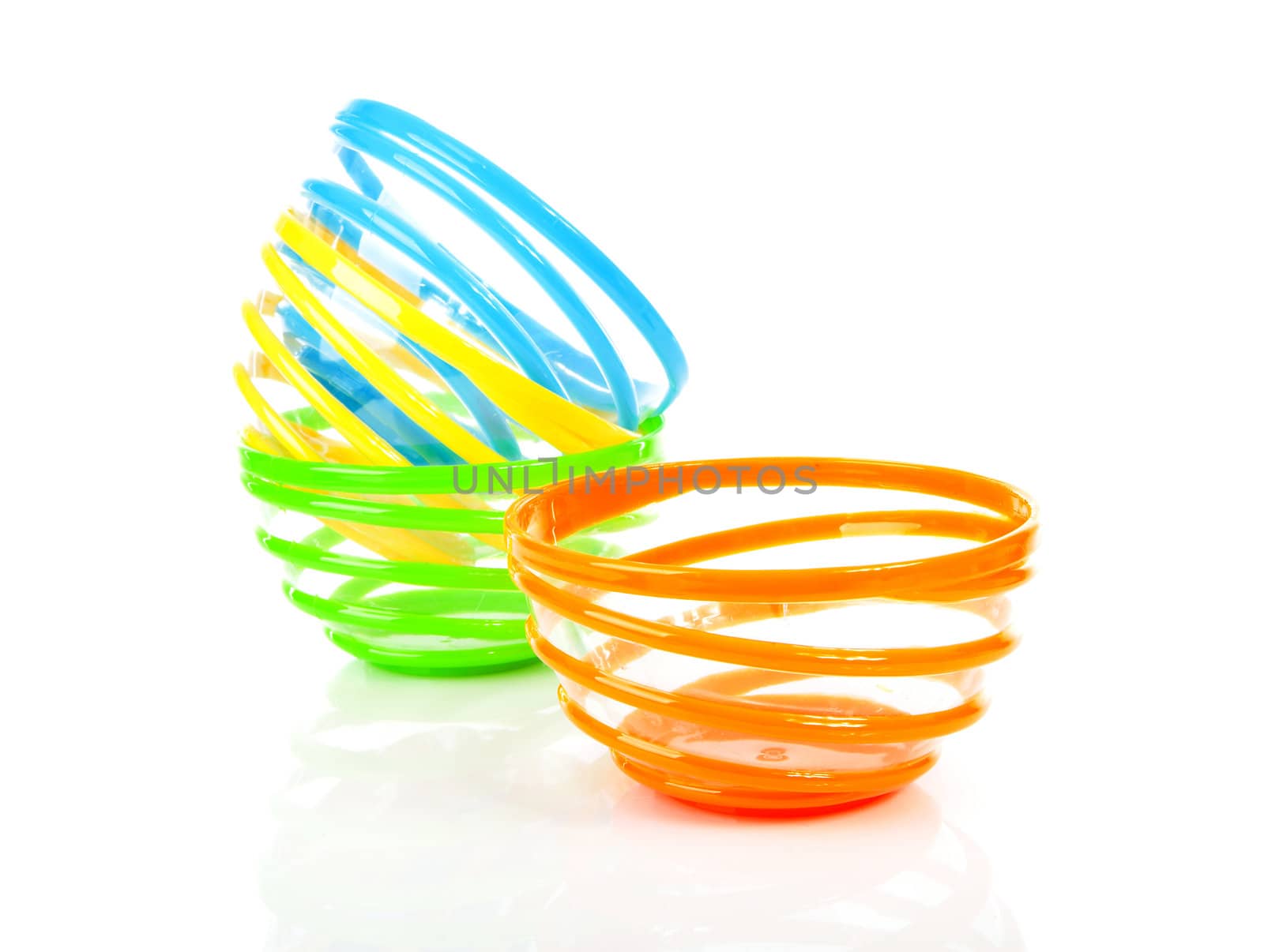 Colorful stacked funny bowl over white background