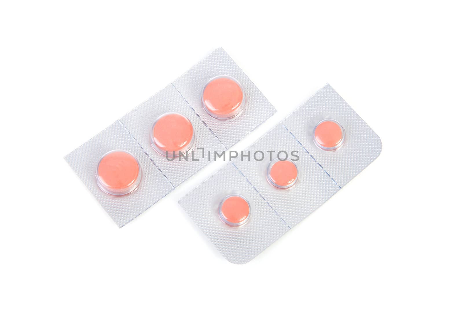 malaria pills in closeup over white background
