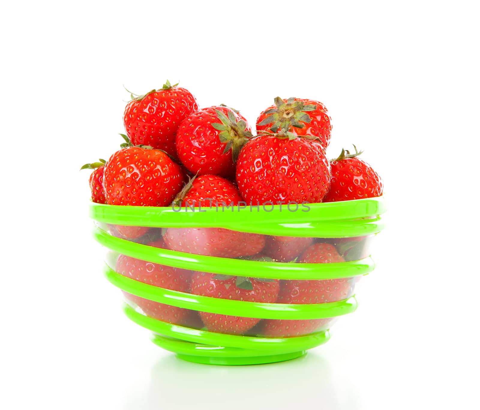 Bowl with fresh strawberries over white background