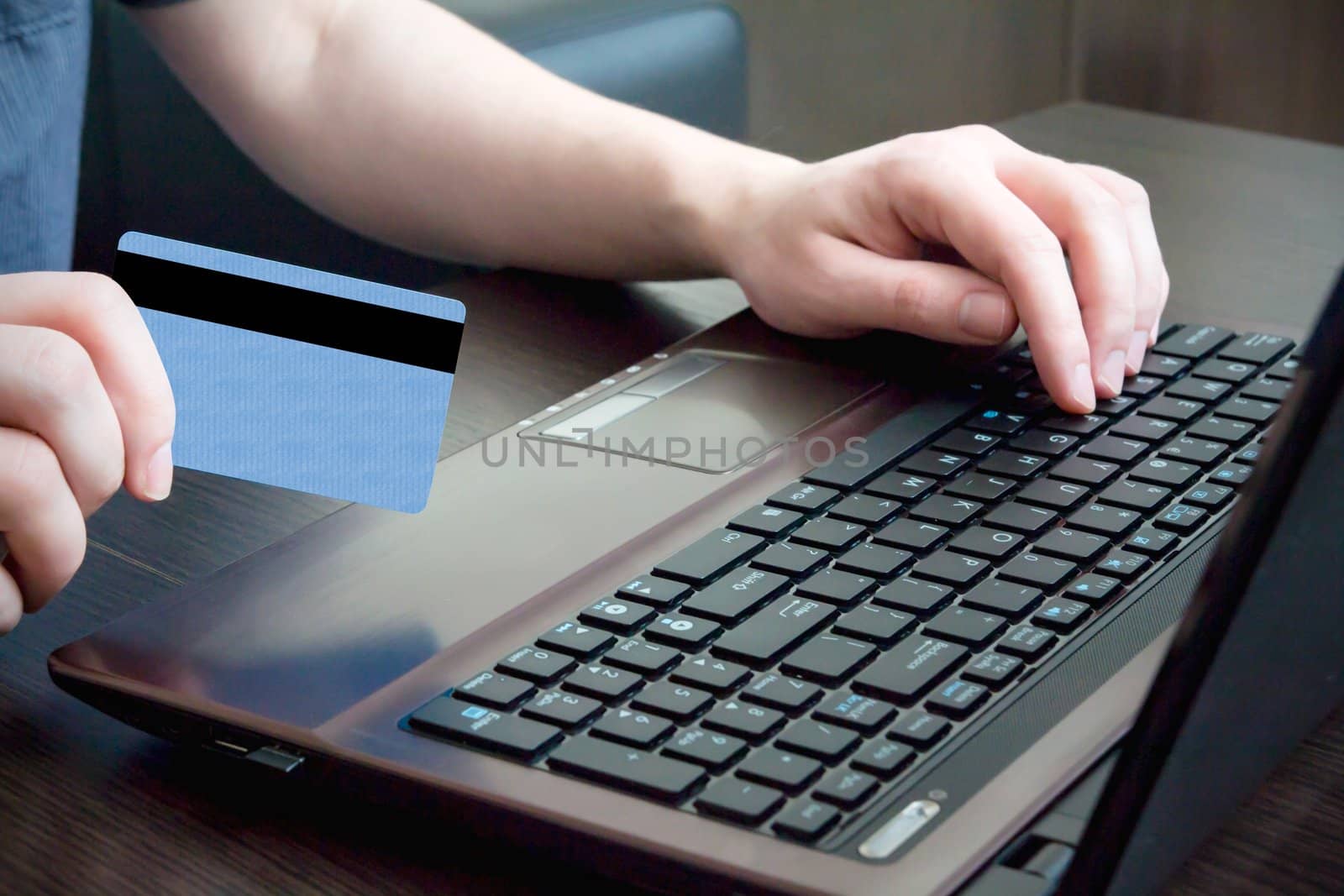 Man hand on keyboard with credit card by simpson33