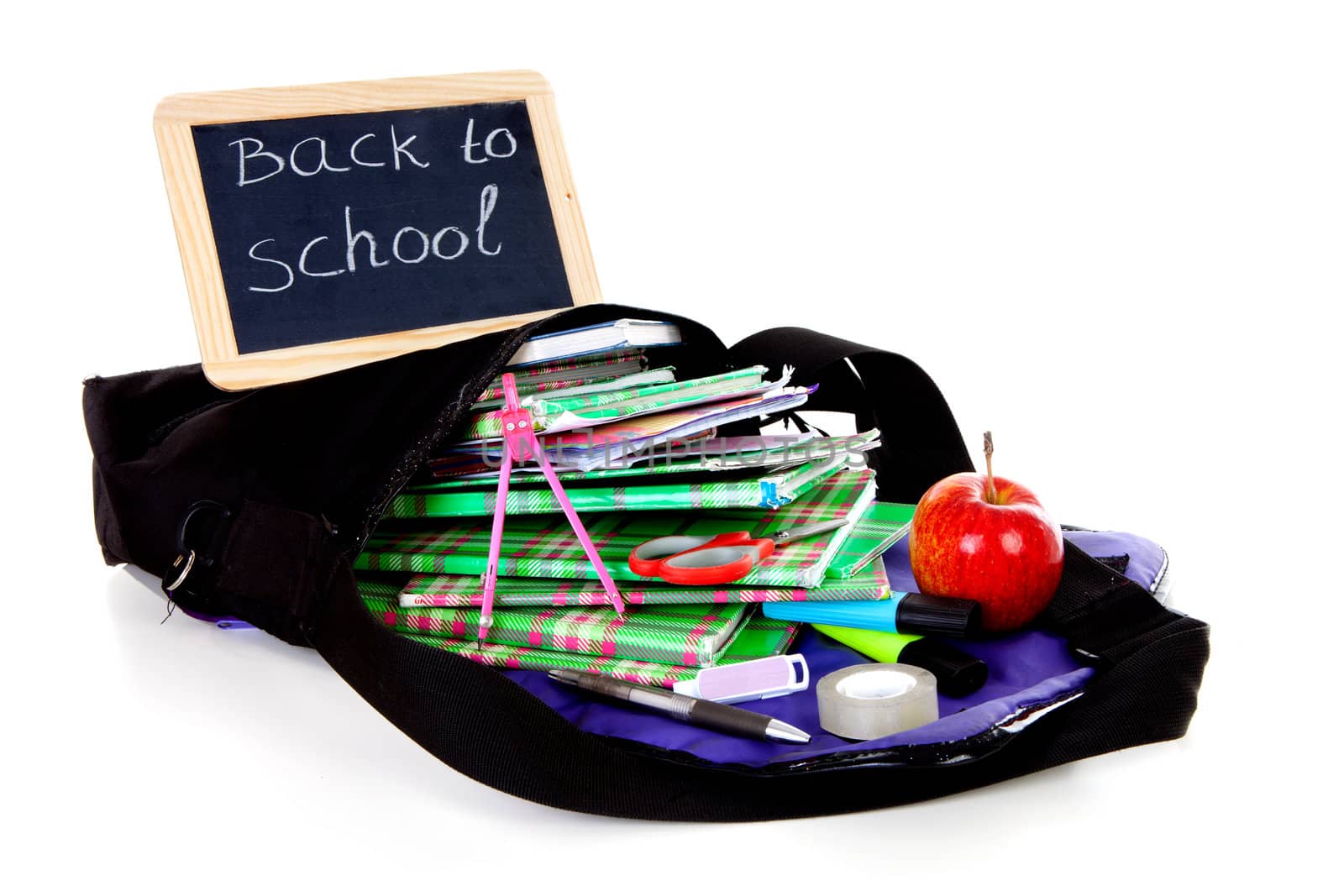 back to school: blackboard slate on bag with books with apple over white background 
