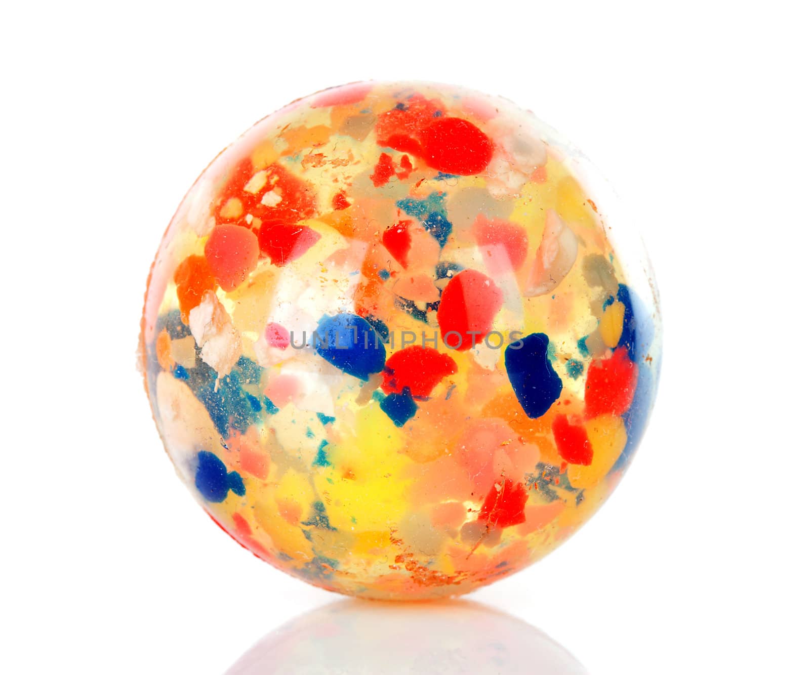 colorful bouncing ball in closeup over white background
