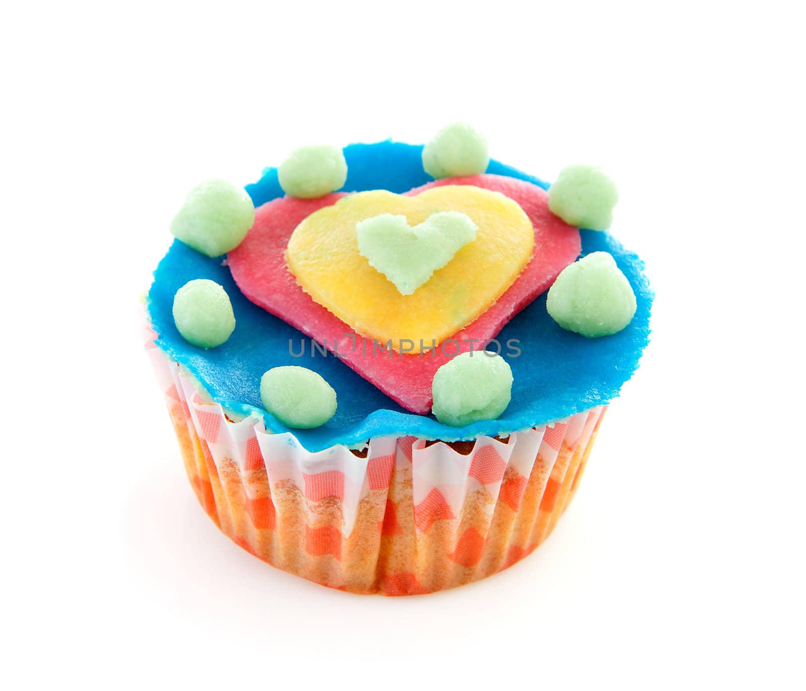cupcake with marzipan heart decoration over white background