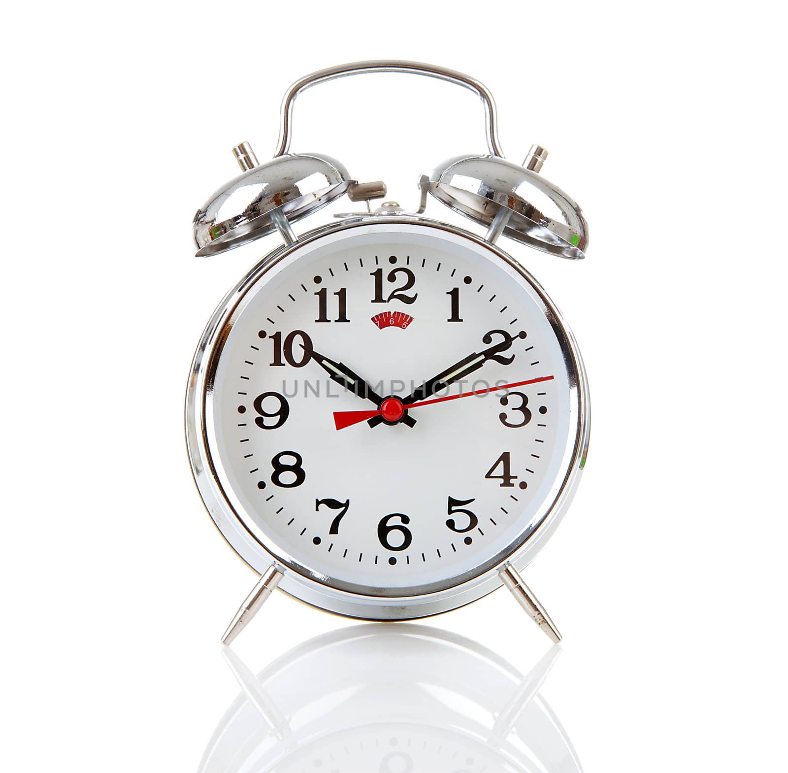 Silver alarm clock over white background