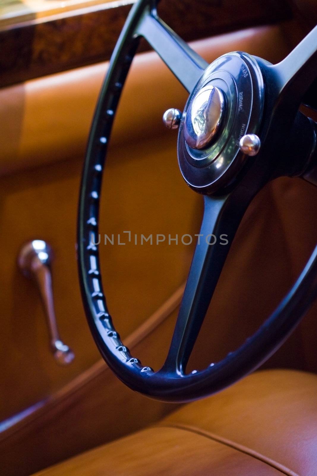 Closeup on vintage car steering wheel, interior retro oldtimer