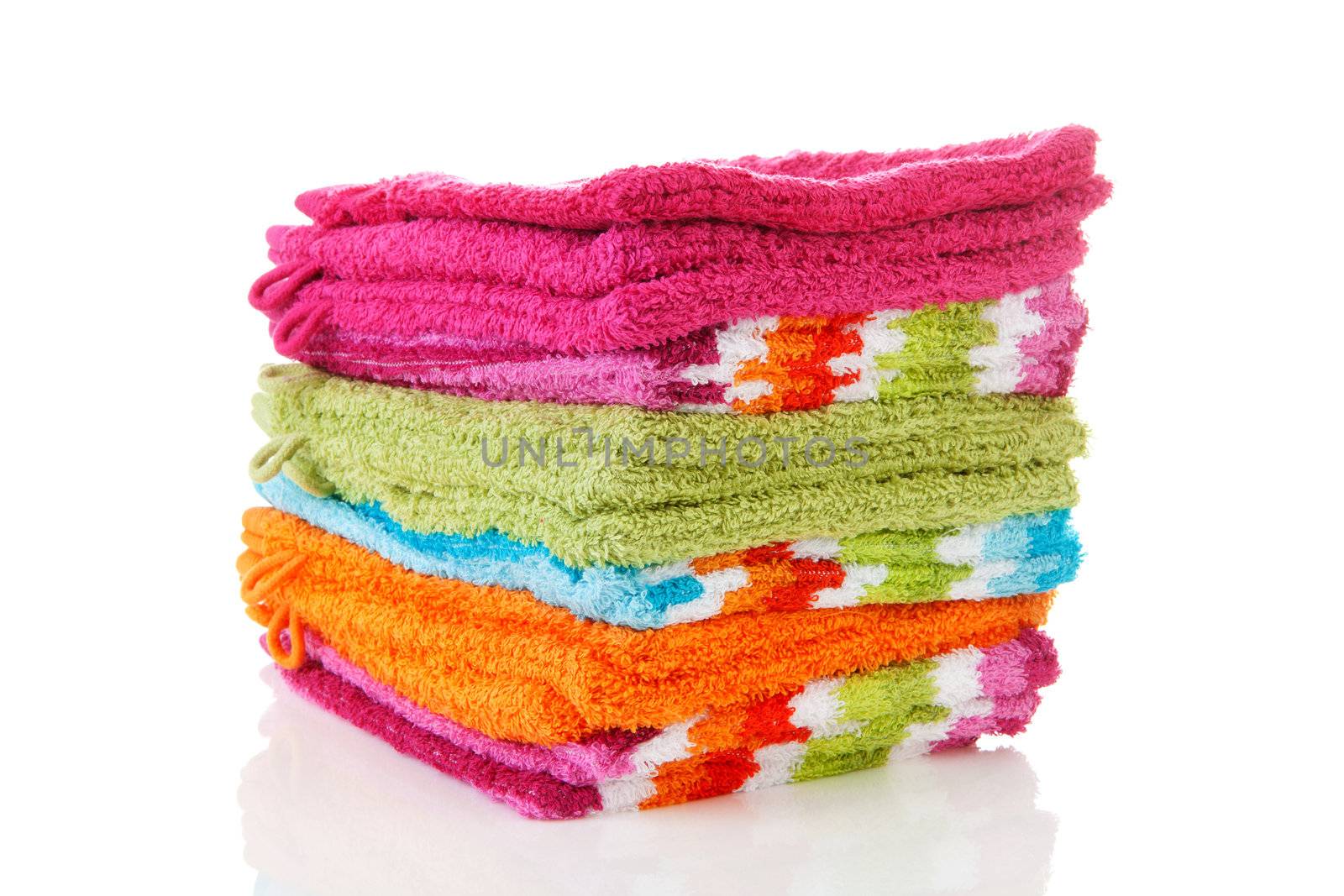 Pile of colorful washclothes over white background
