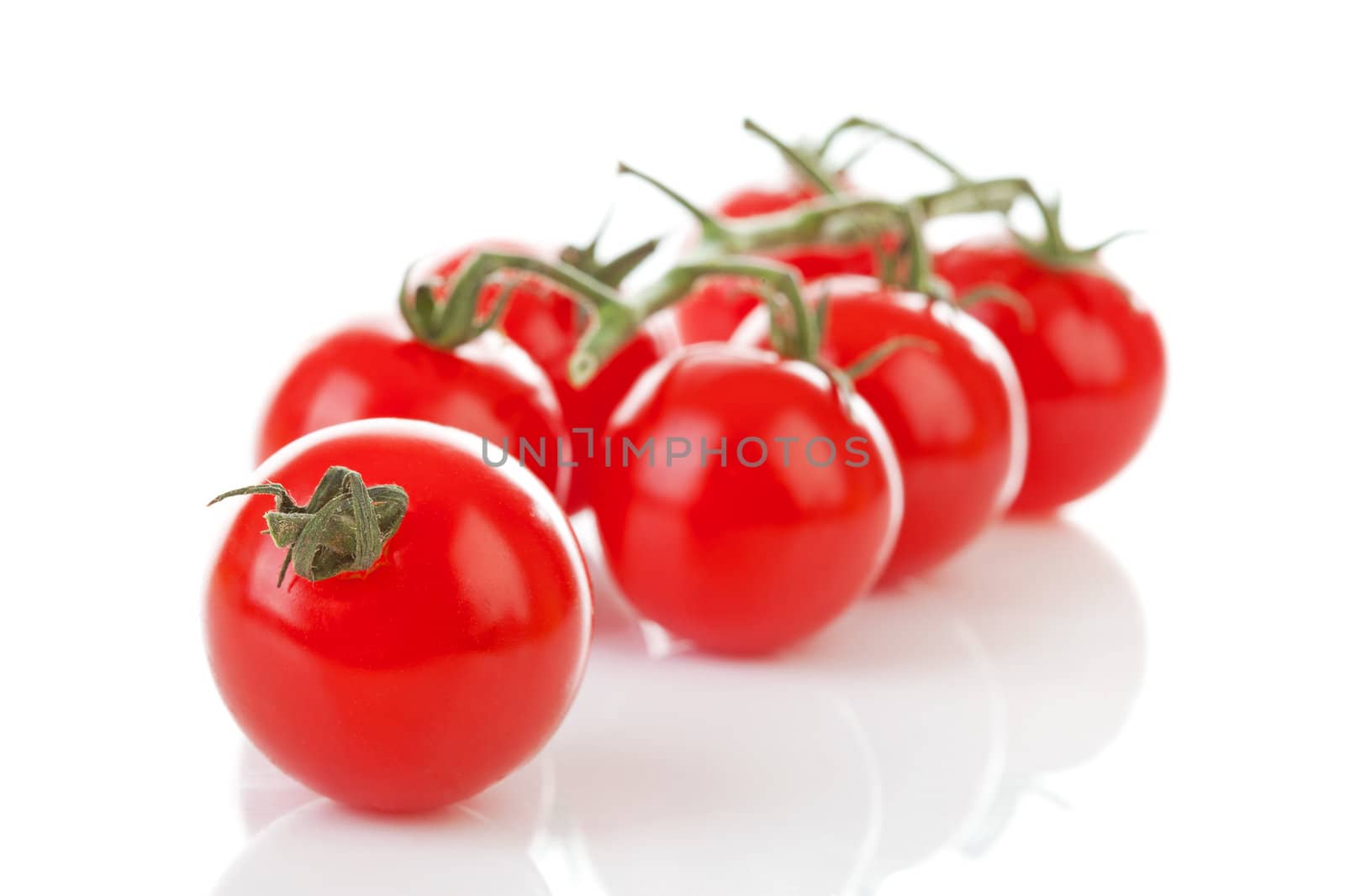 Bunch of fresh tomatoes over white background