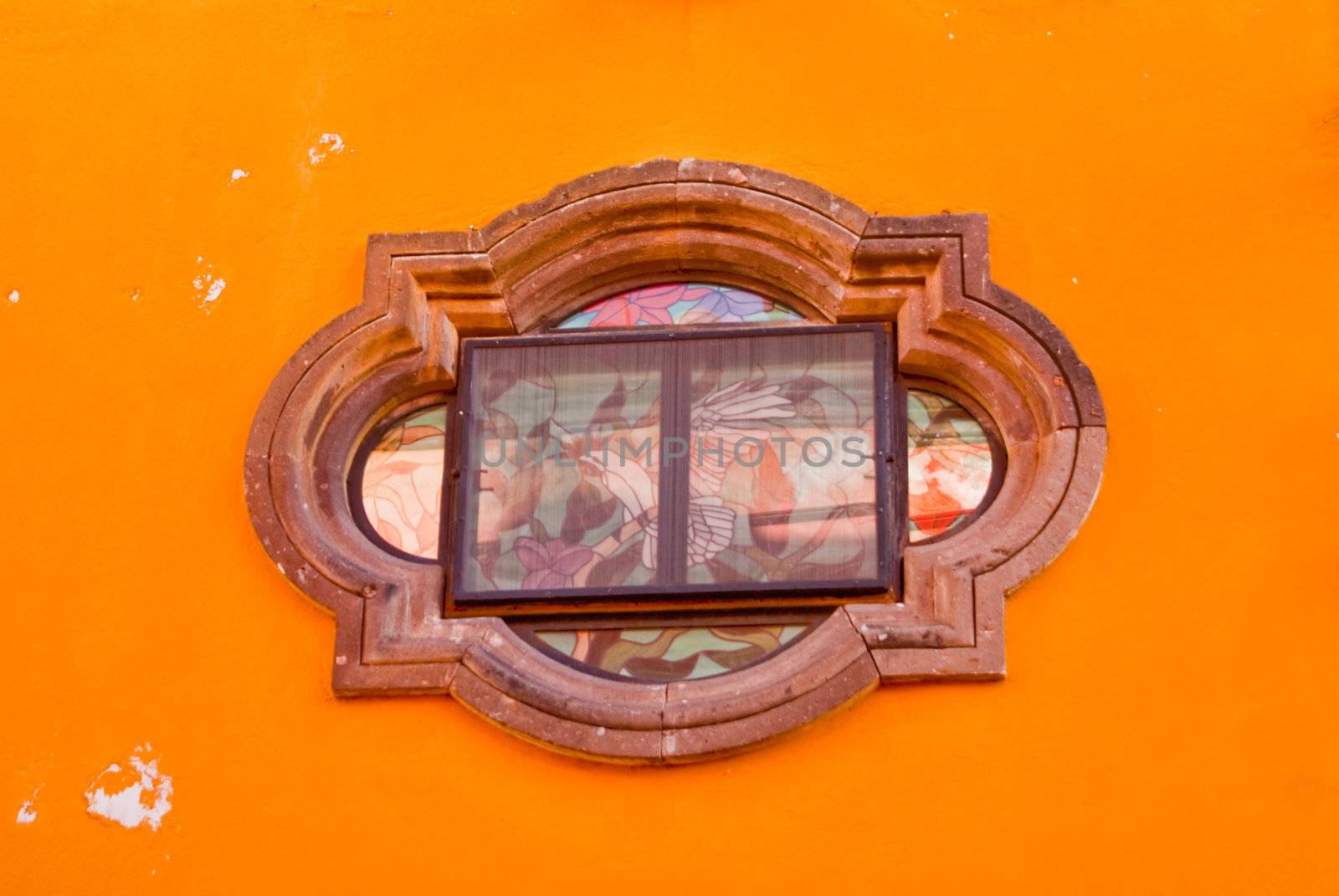 Unique Mexican Window on Orange Adobe Wall by emattil