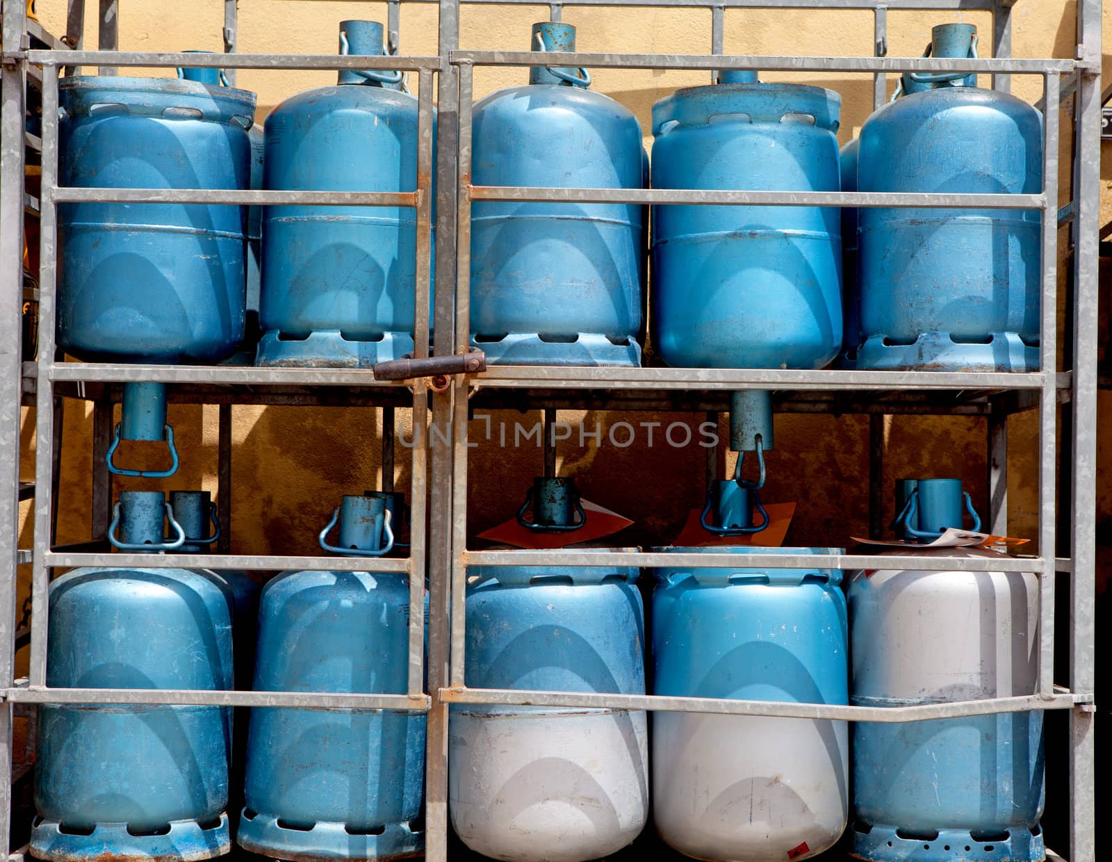 Storage with blue bottles of gas