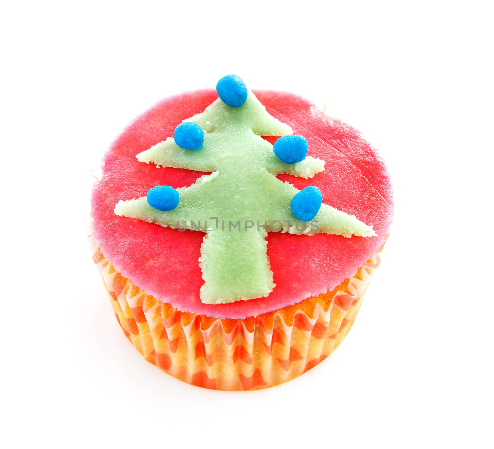 cupcake with marzipan Christmas decoration over white background