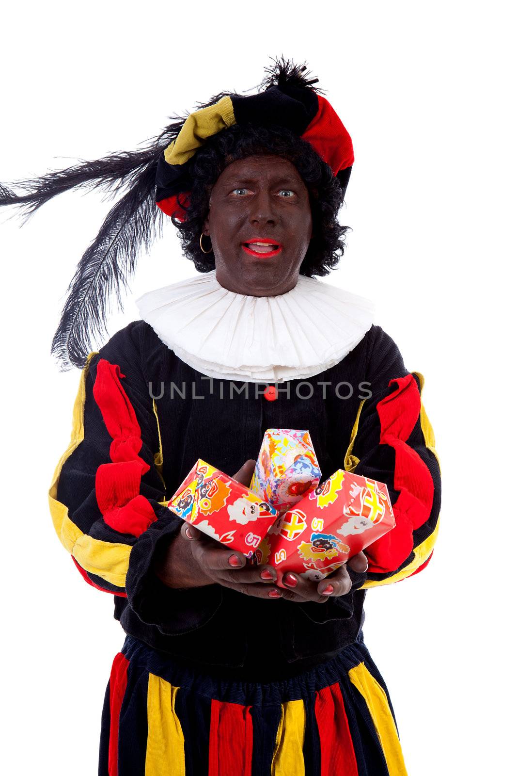 Zwarte piet ( black pete) typical Dutch character part of a traditional event celebrating the birthday of Sinterklaas in december over white background with presents