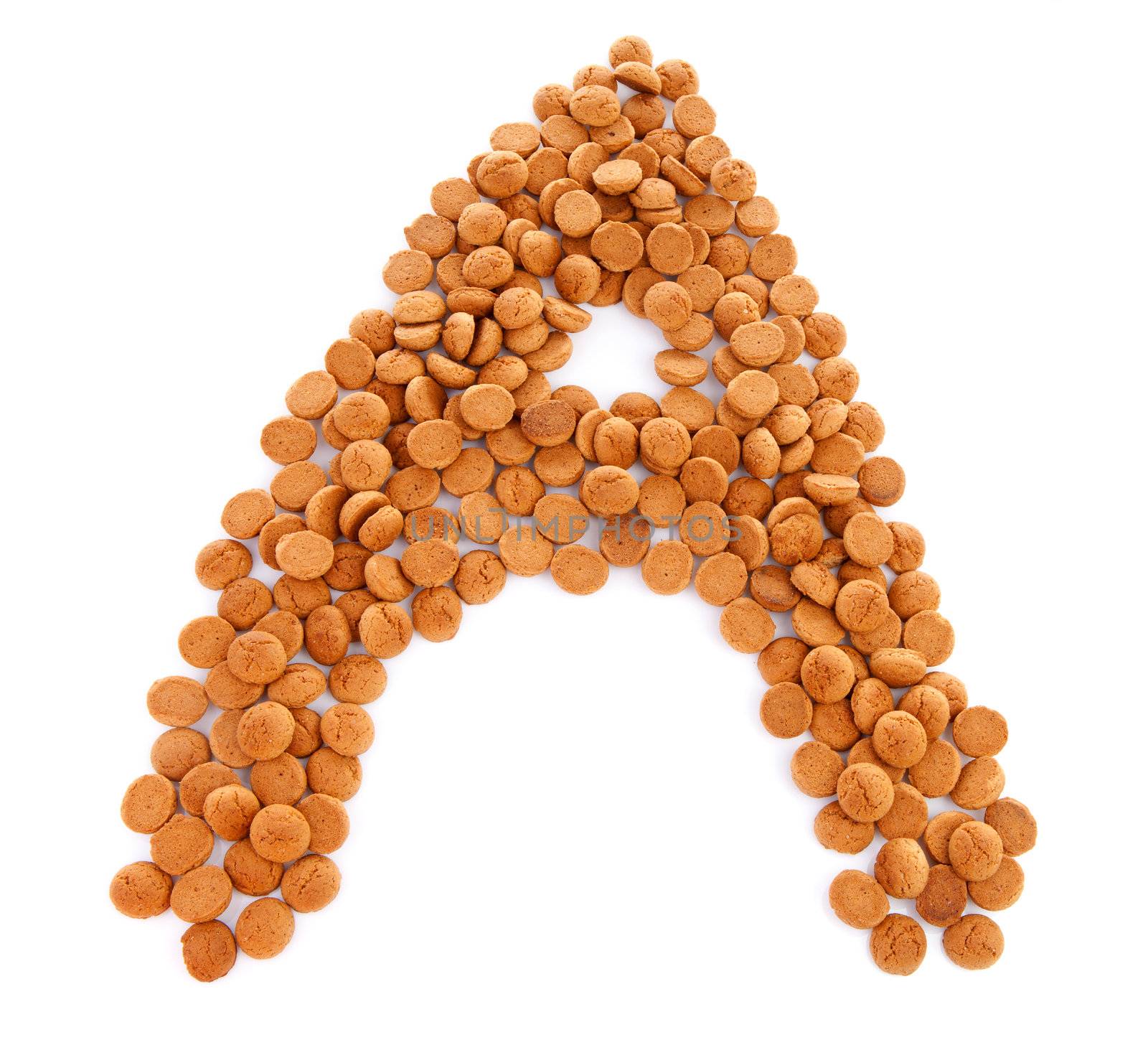 Ginger nuts, pepernoten, in the shape of letter A isolated on white background. Typical Dutch candy for Sinterklaas event in december