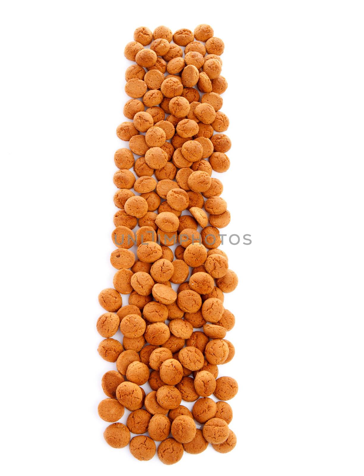 Ginger nuts, pepernoten, in the shape of letter I isolated on white background. Typical Dutch candy for Sinterklaas event in december