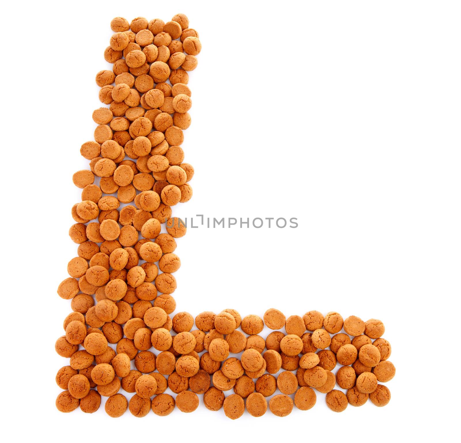 Ginger nuts, pepernoten, in the shape of letter L isolated on white background. Typical Dutch candy for Sinterklaas event in december