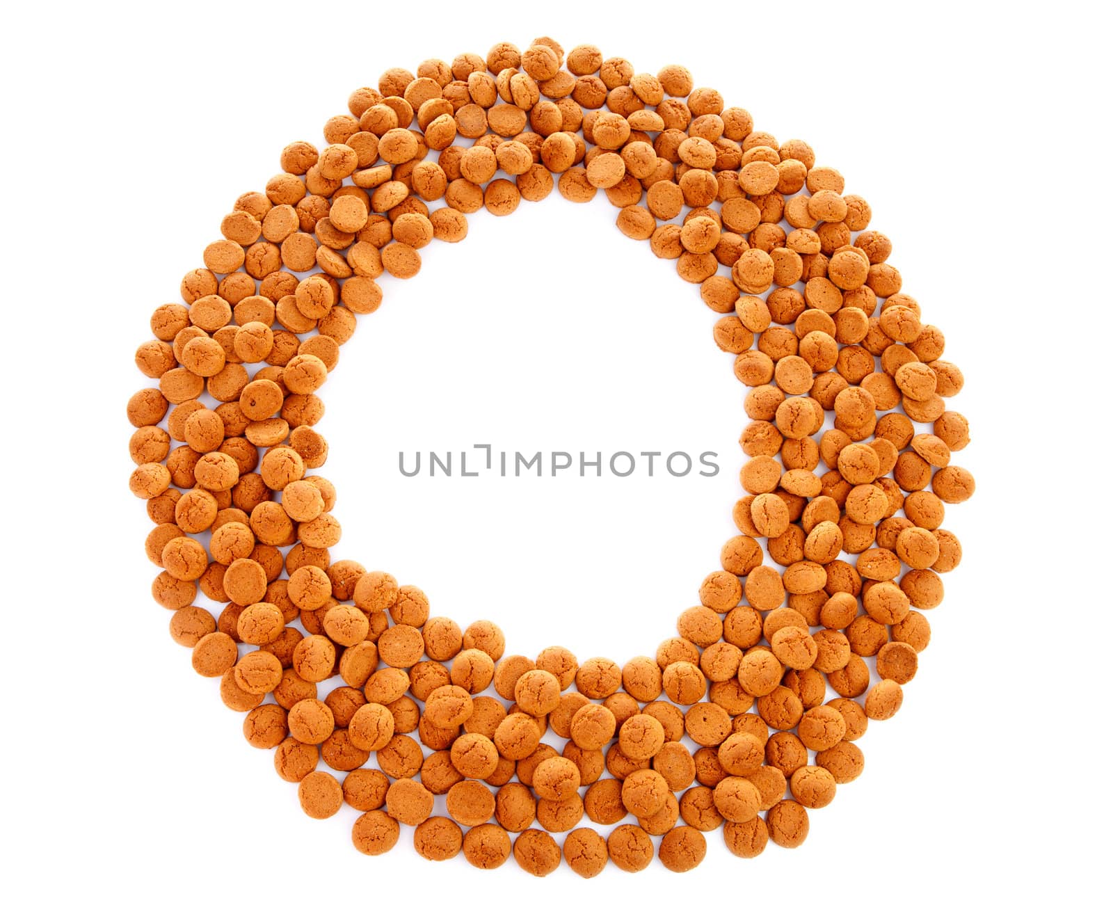 Ginger nuts, pepernoten, in the shape of round and letter 0 isolated on white background. Typical Dutch candy for Sinterklaas event in december