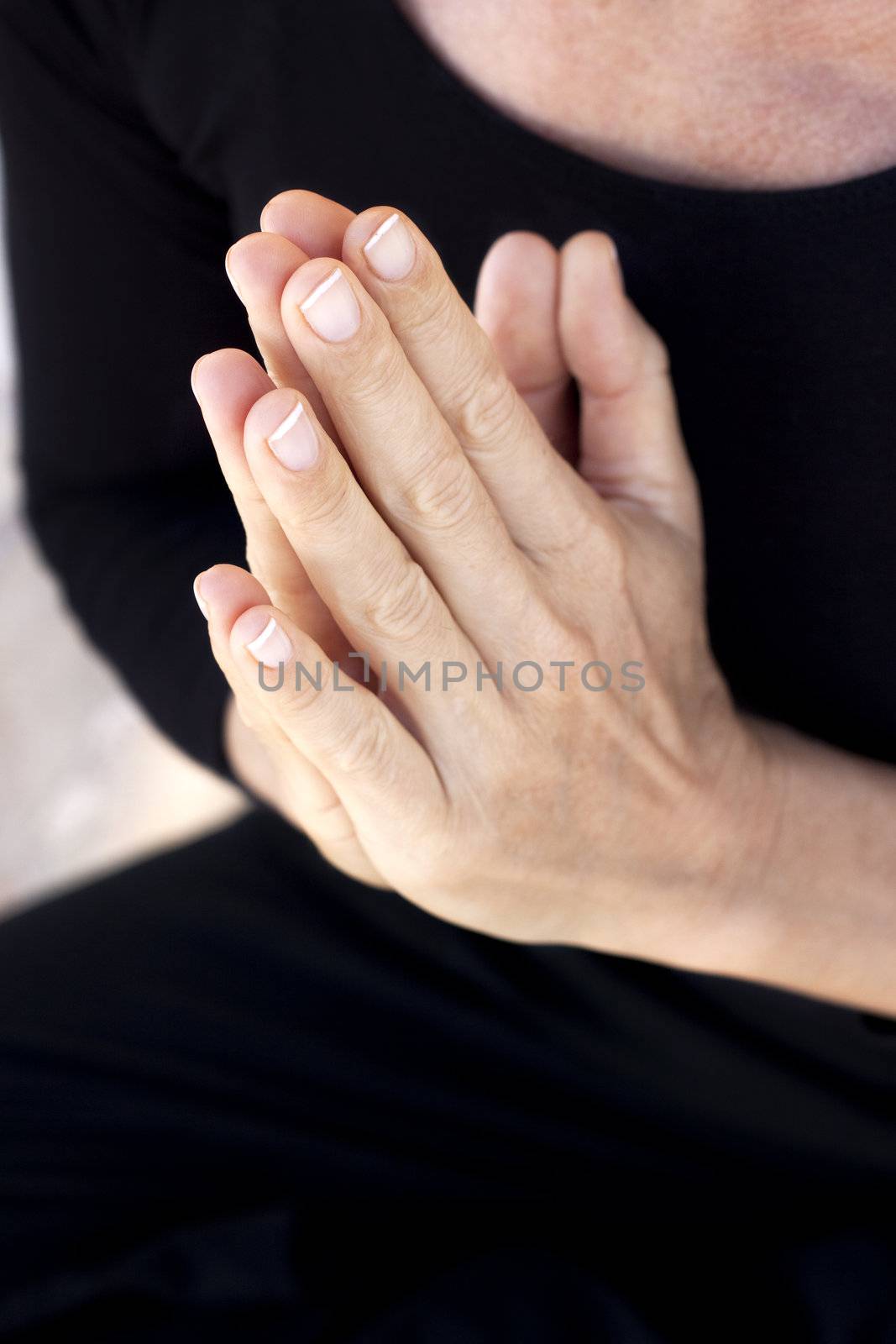 Hands held together in prayer or yoga greeting