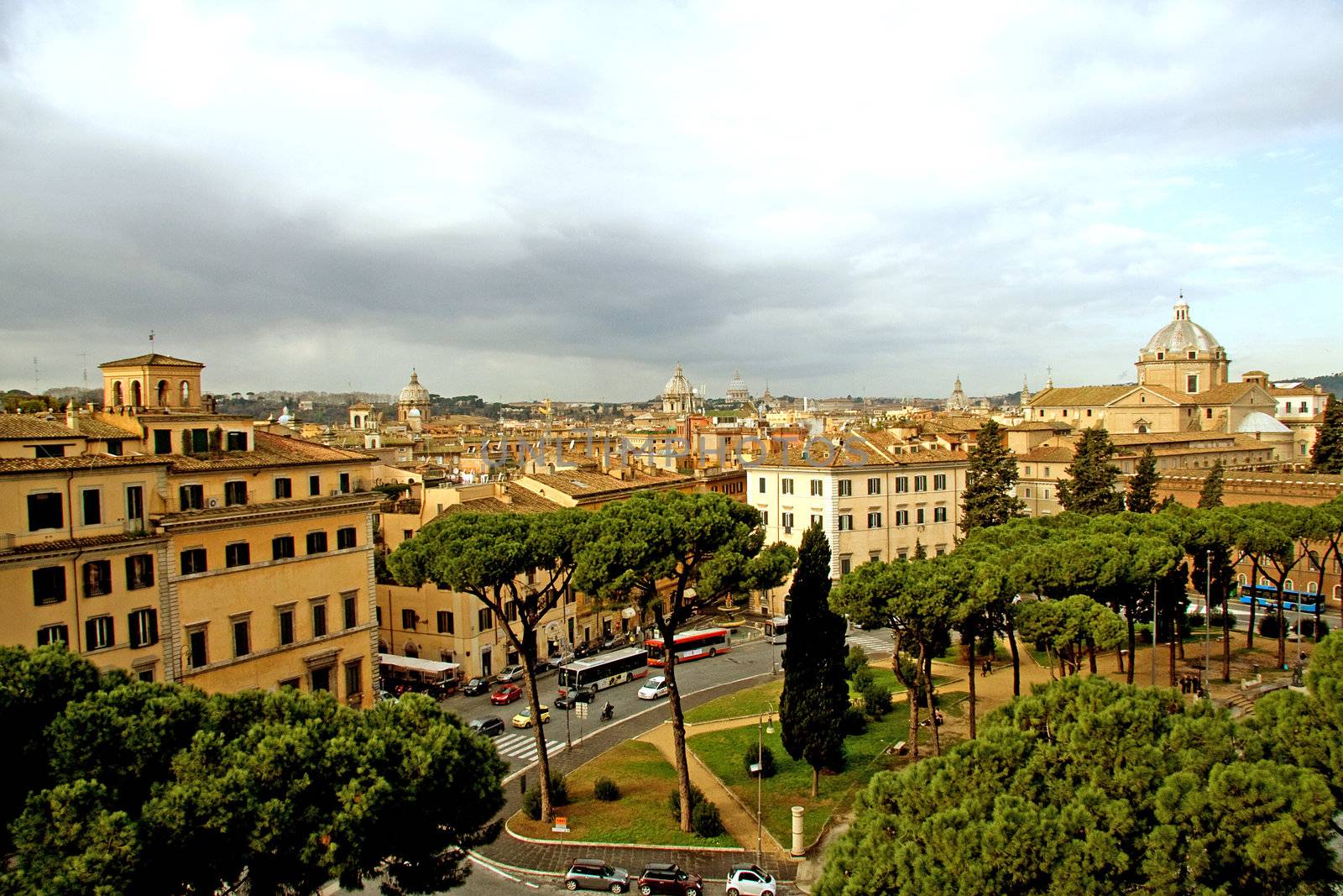 View over Rome from piazza Venezia with Vatican on the background under threatening clouds