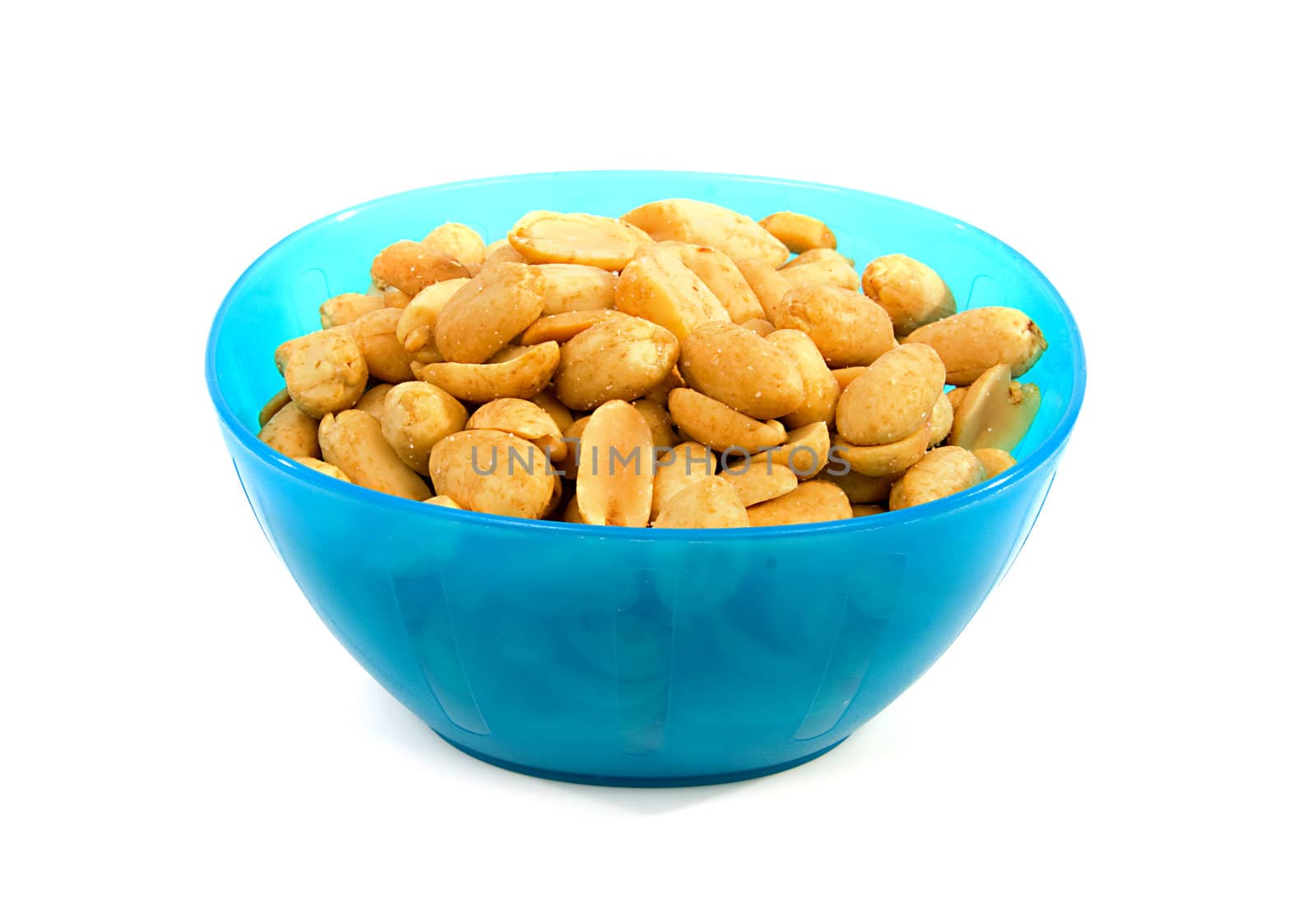Blue bowl with salted peanuts over white background